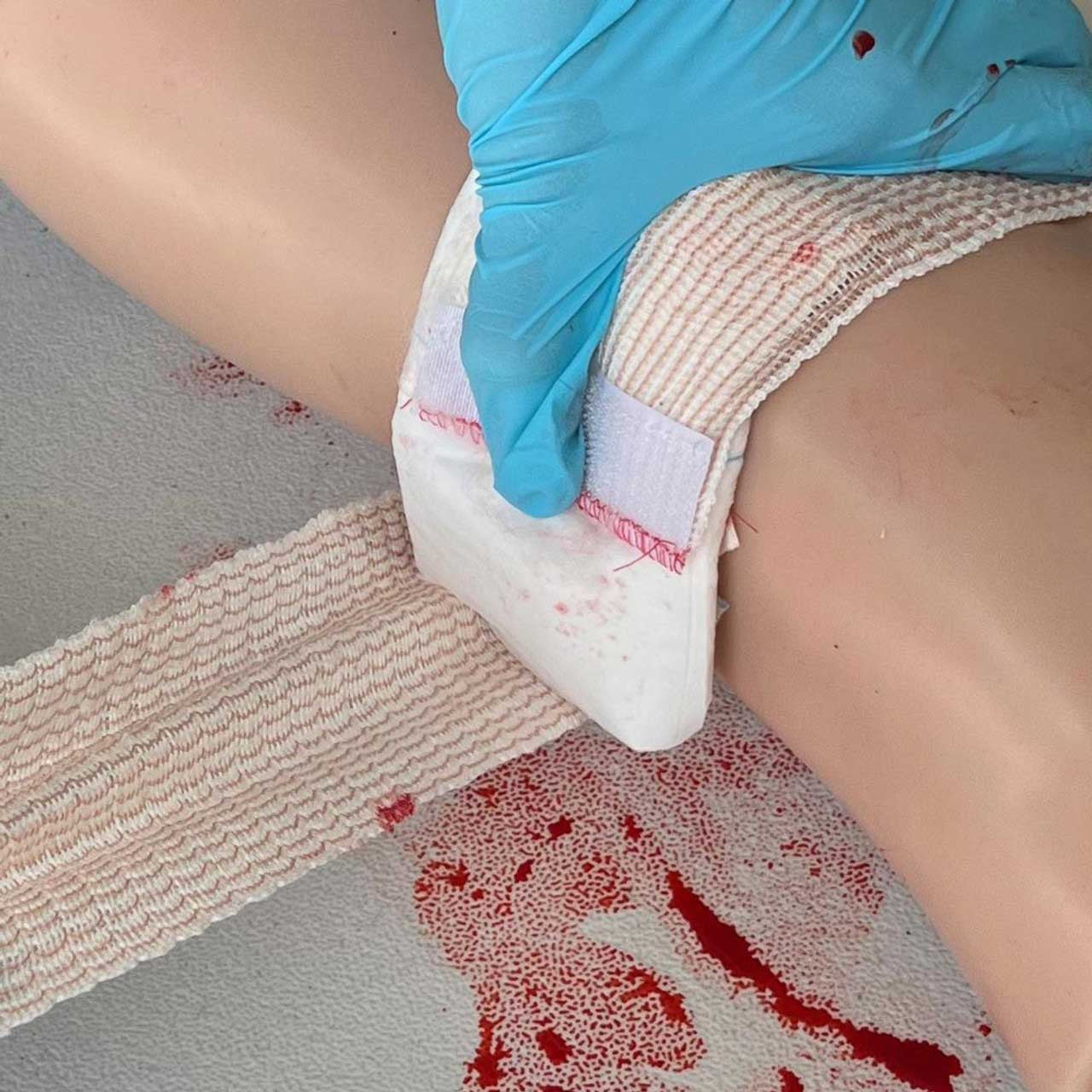 Rescue Essentials WoundPack Bandage System, in use