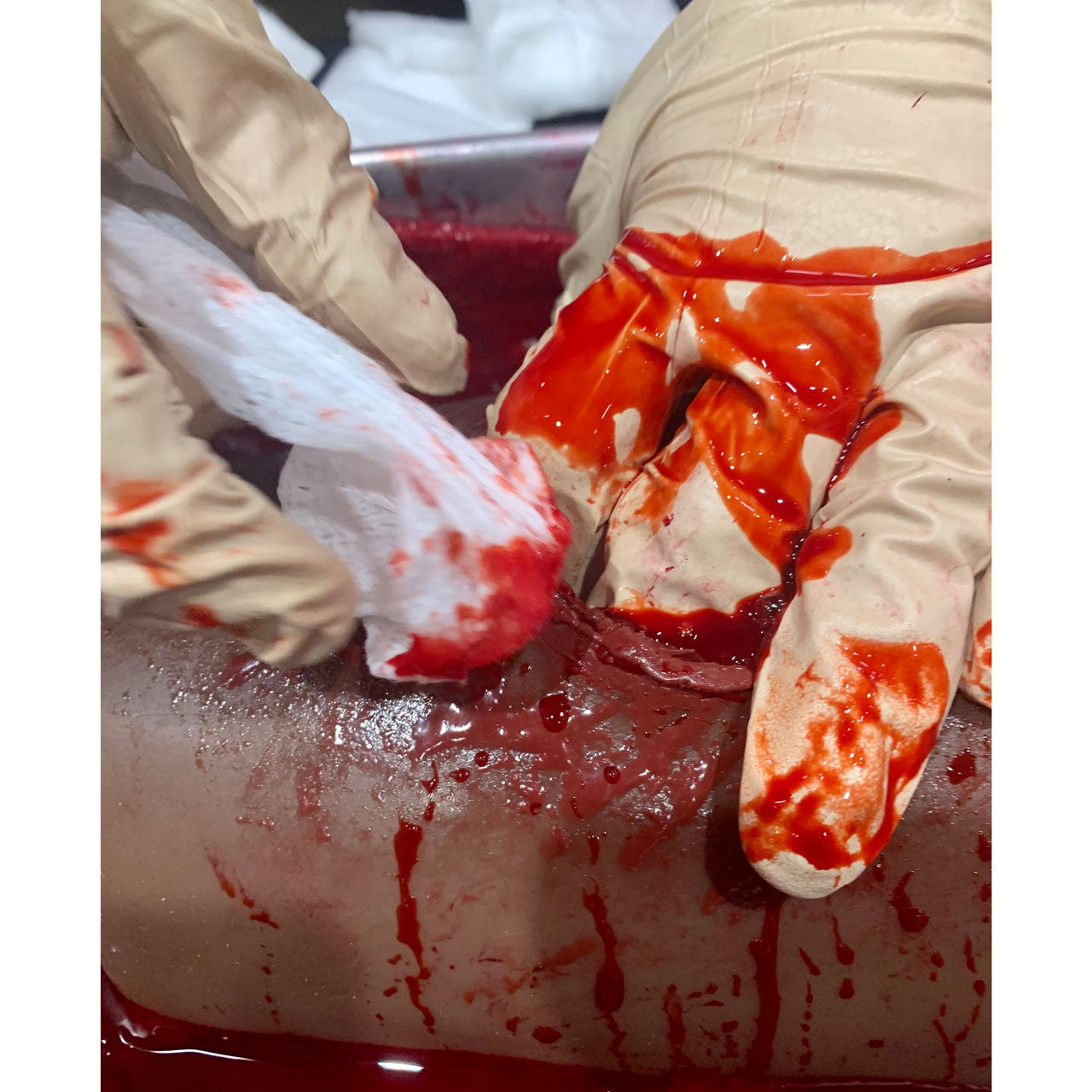 Dark Tone TrueClot® Wound Packing Task Trainer, In use