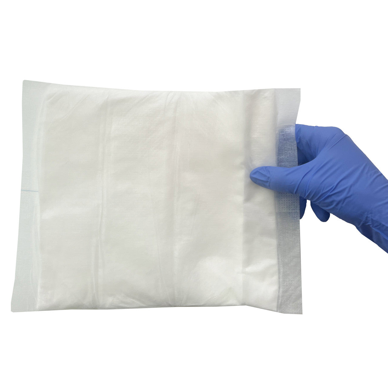 Combine ABD Pad, unfolded in hand