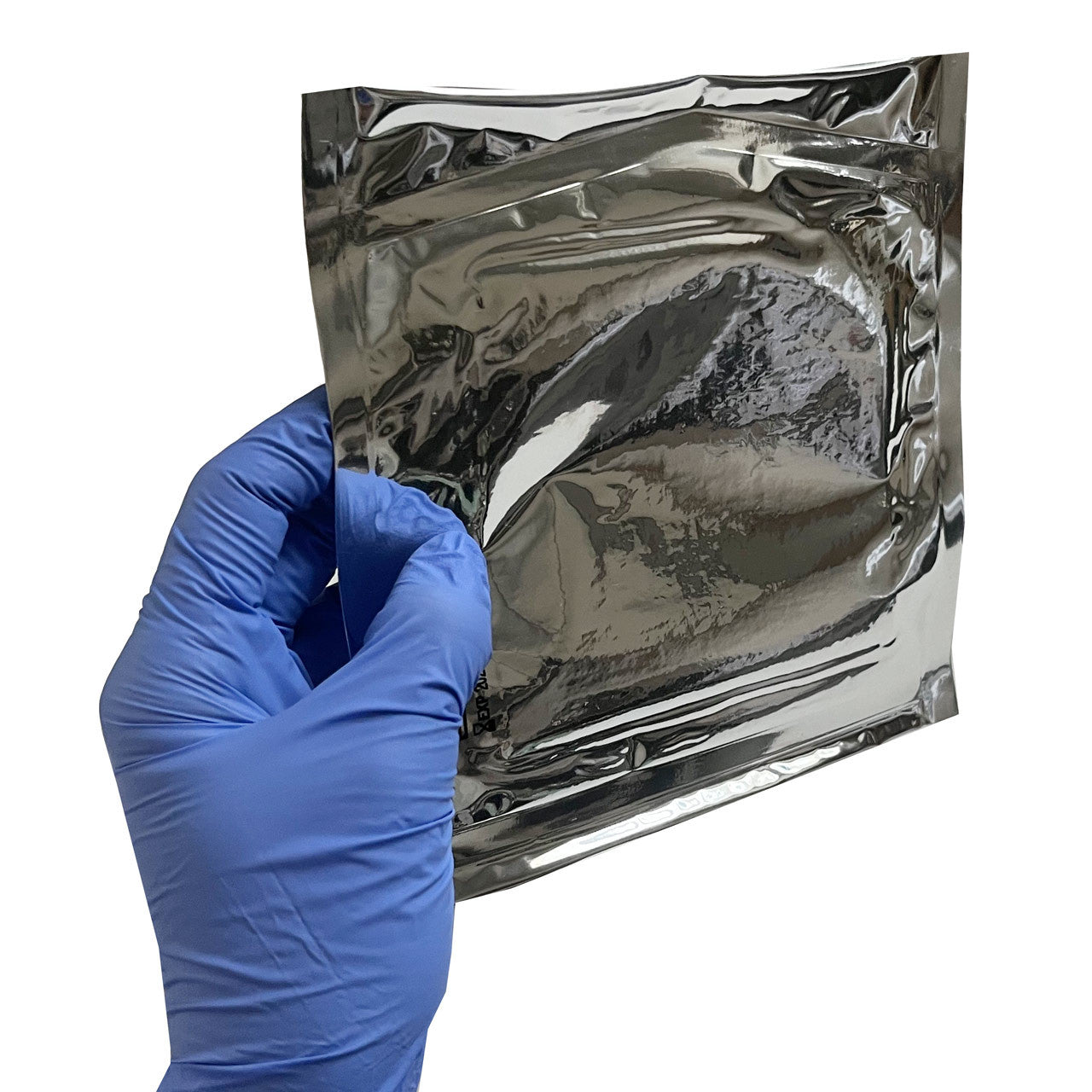 4" x 4" Petrolatum Impregnated Gauze Dressing, back of package in hand