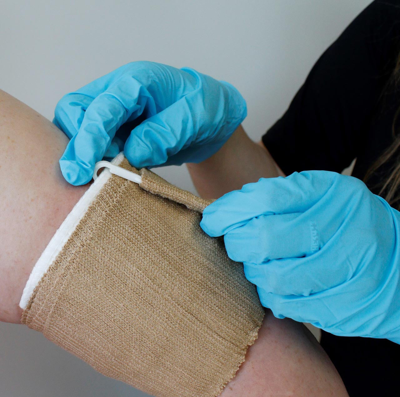 Rescue Essentials Emergency Trauma Dressing, in use on arm