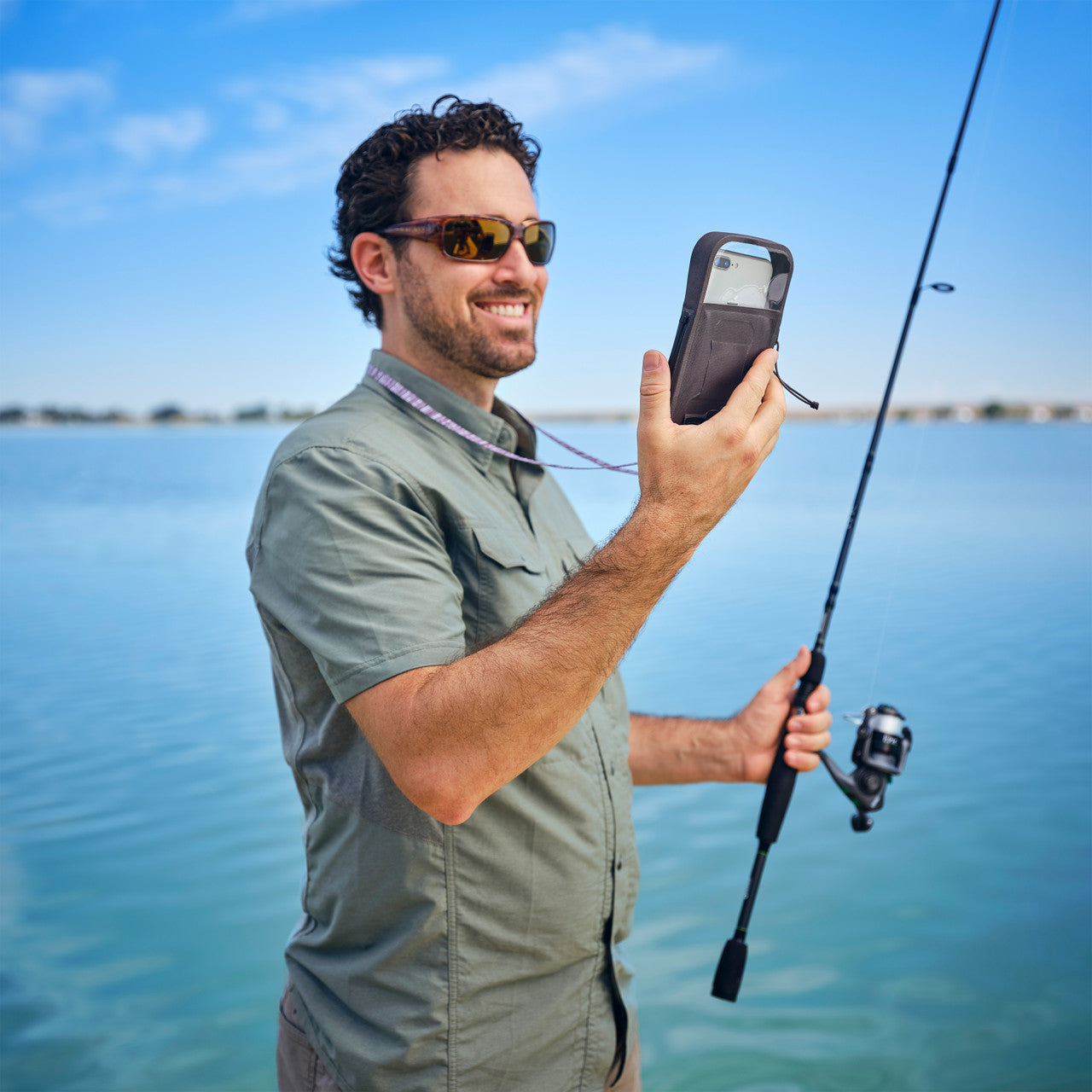 RunOff® Waterproof Phone Case, in use fishing