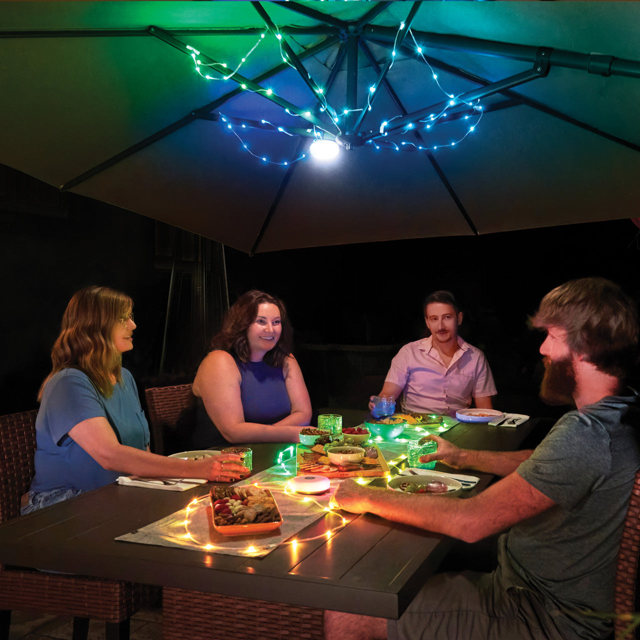 Radiant® StarLit™ Rechargeable Lantern + String Light, in use on patio