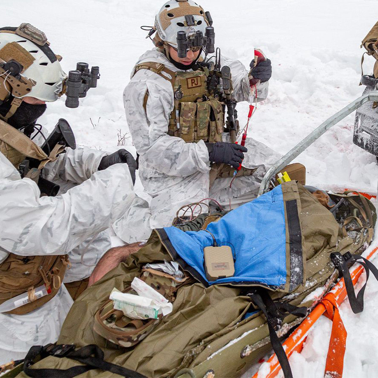 Insulated Hypothermia Prevention & Management Kit, in use in snow