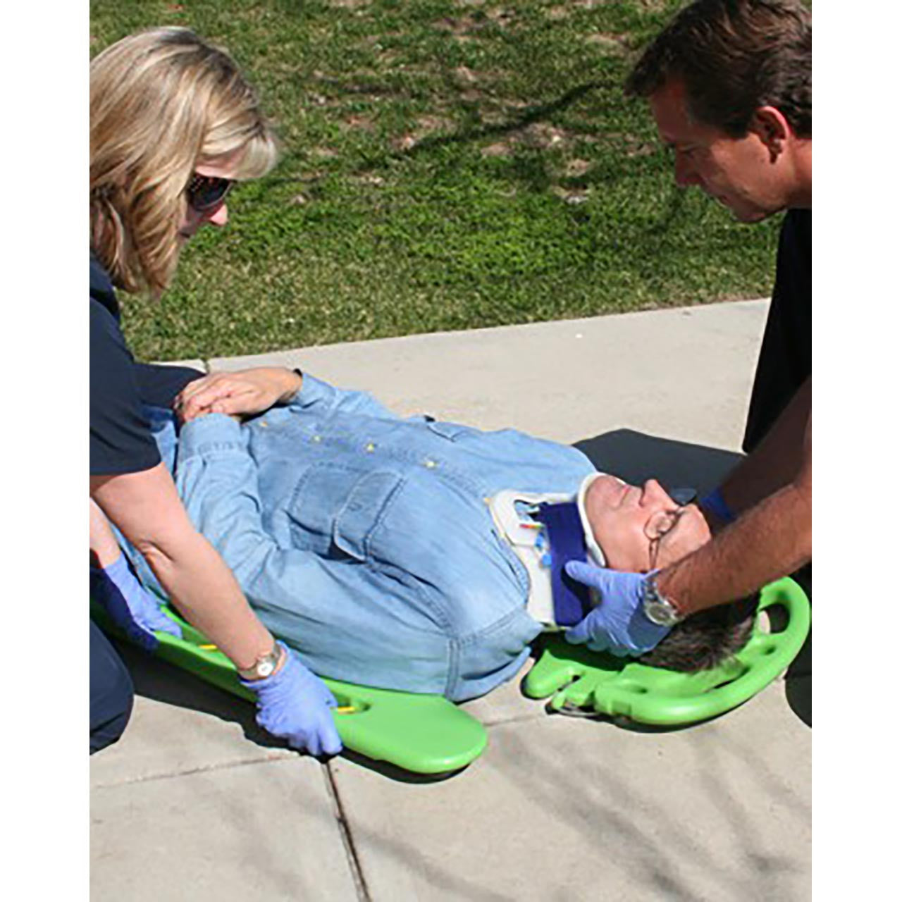 CombiCarrier in use, stabilizing patient's head and neck while applying board