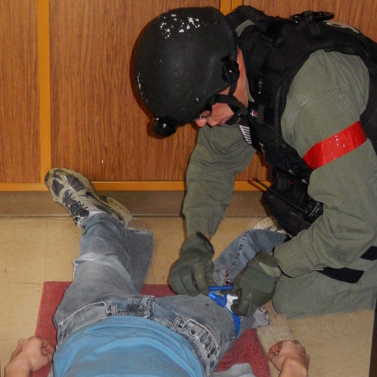 Combat application tourniquet CA, blue trainer by North American Rescue NAR in action 2