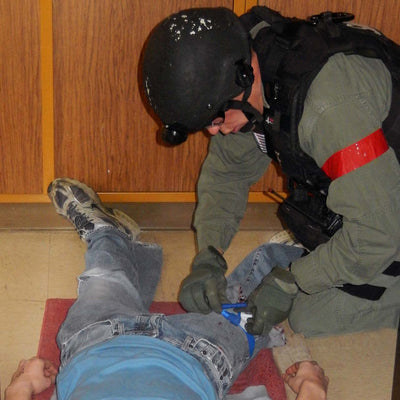 Combat application tourniquet CA, blue trainer by North American Rescue NAR in action 2