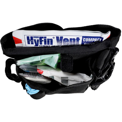 Rescue Essentials FLAT IFAK, kit packed in pouch and showing open view of the SOFTT-W tourniquet loadout option, top view of components in pocket