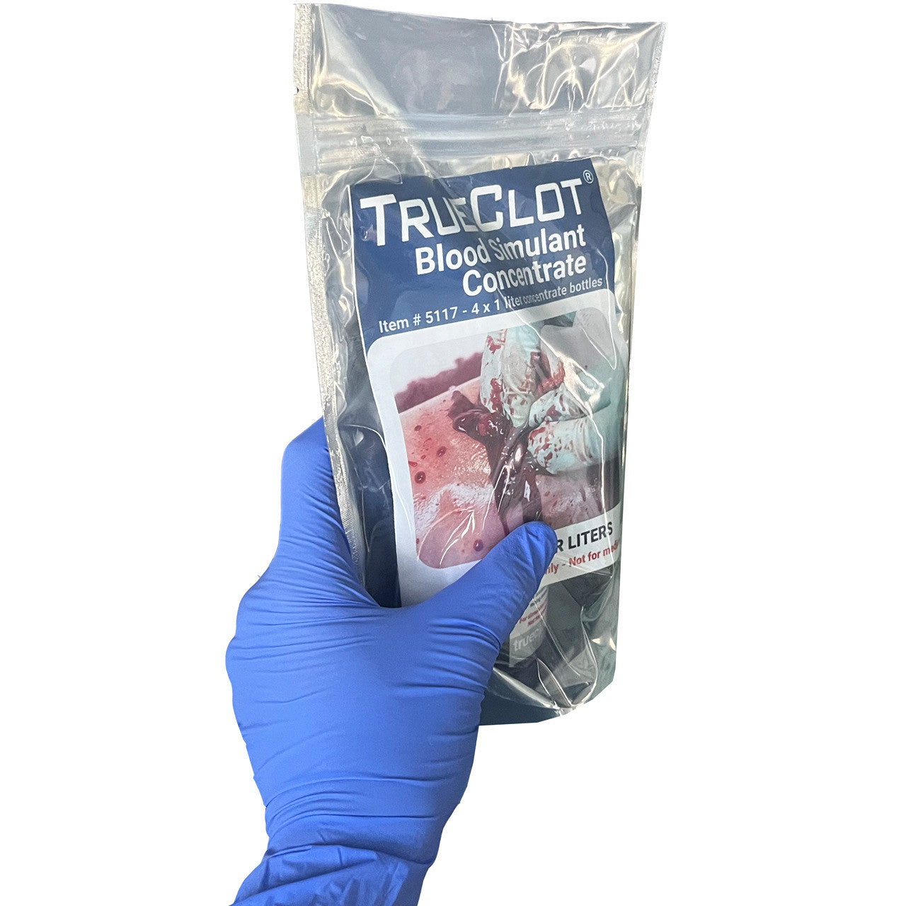 TrueClot® Blood Simulant Concentrate, in packaging (in hand)