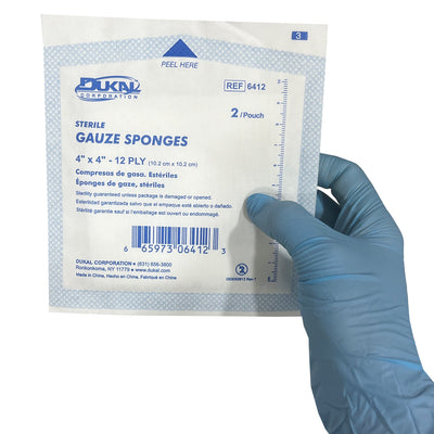 Sterile Gauze 4" x 4" Sponges, one in hand