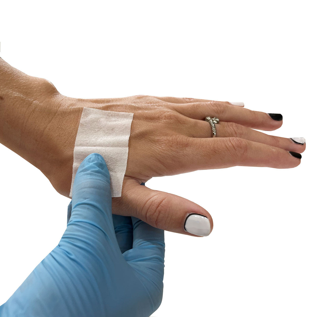 Sting Relief Wipe, in use on hand