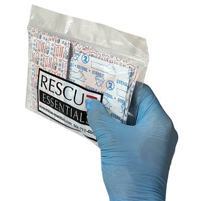 Assorted Adhesive Bandages, in hand front-side