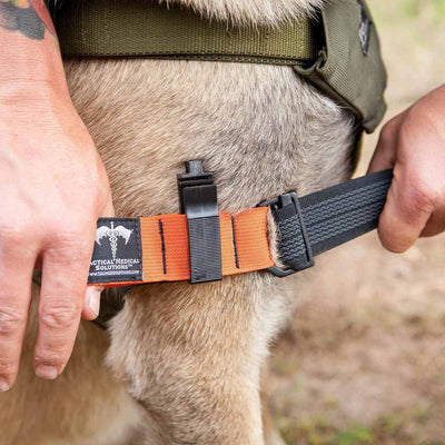 K9 Handler Trauma Kit by TacMed Solutions showing tourniquet in action