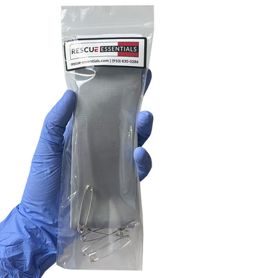  Pocket Tape w/Safety Pins in packaging being held in hand