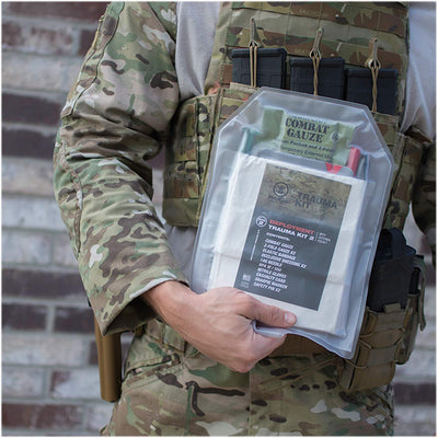 Deployment Trauma Kit II with External Pill Pouch by Phokus Research, being pulled from under armor