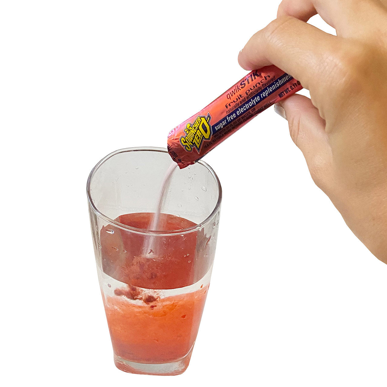sqwinchers hydration powder, pouring into glass of water