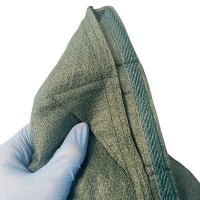NAR Dry Sterile Burn Dressing, folded bandage in hand