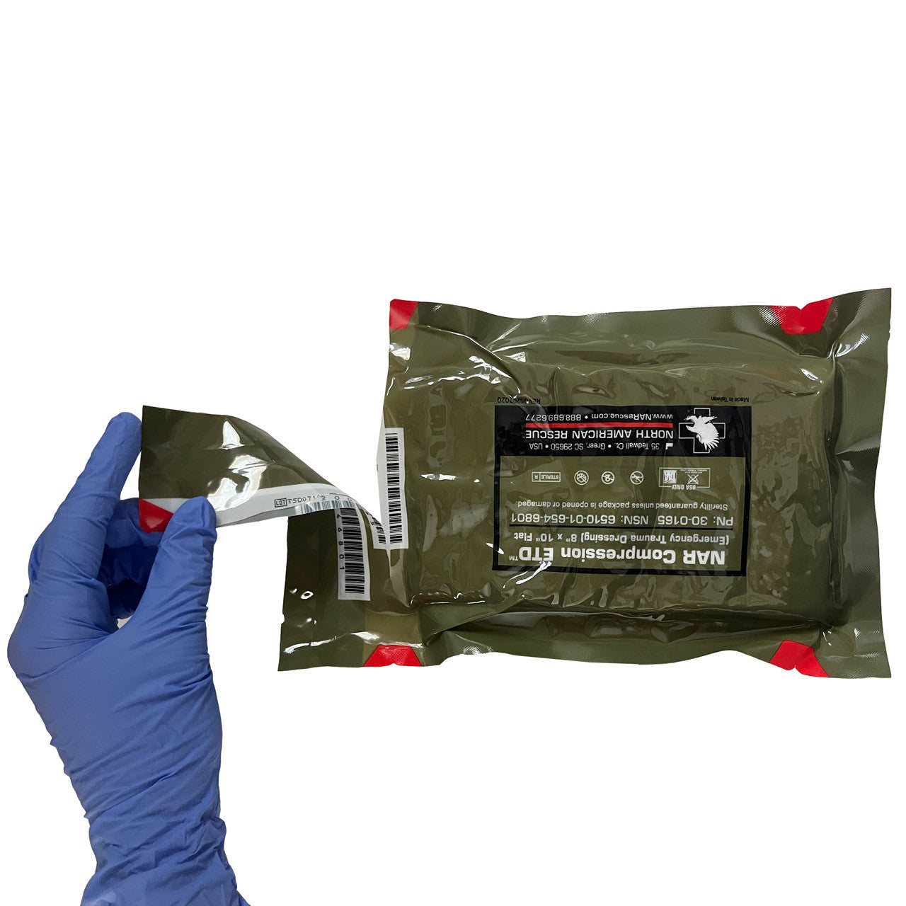 Emergency Trauma Dressing, being opened