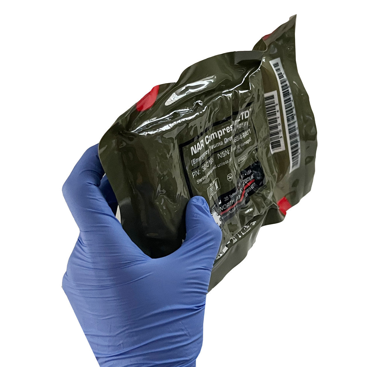Emergency Trauma Dressing, being held