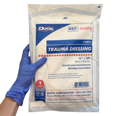 10"x 30" Trauma Dressing, Sterile, Single in packaging being held in hand