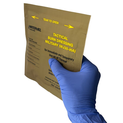 Water-Jel® Military Burn Dressing, front of packaging in hand