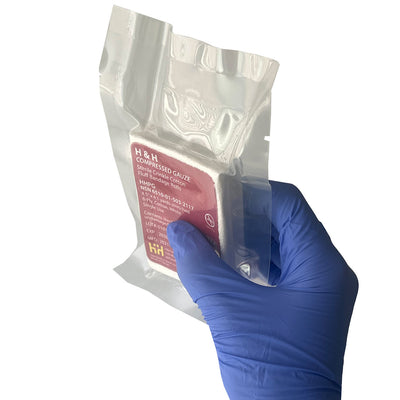  Compressed Gauze, being held