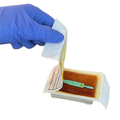 Povidone Iodine Surgical Scrub Brush/Sponge, being opened