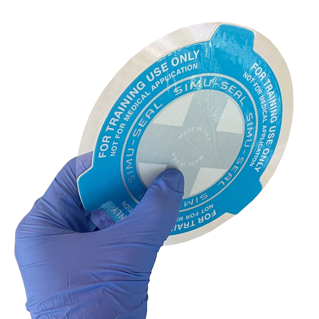 Simu-Seal Chest Seal Trainer, unfolded in hand