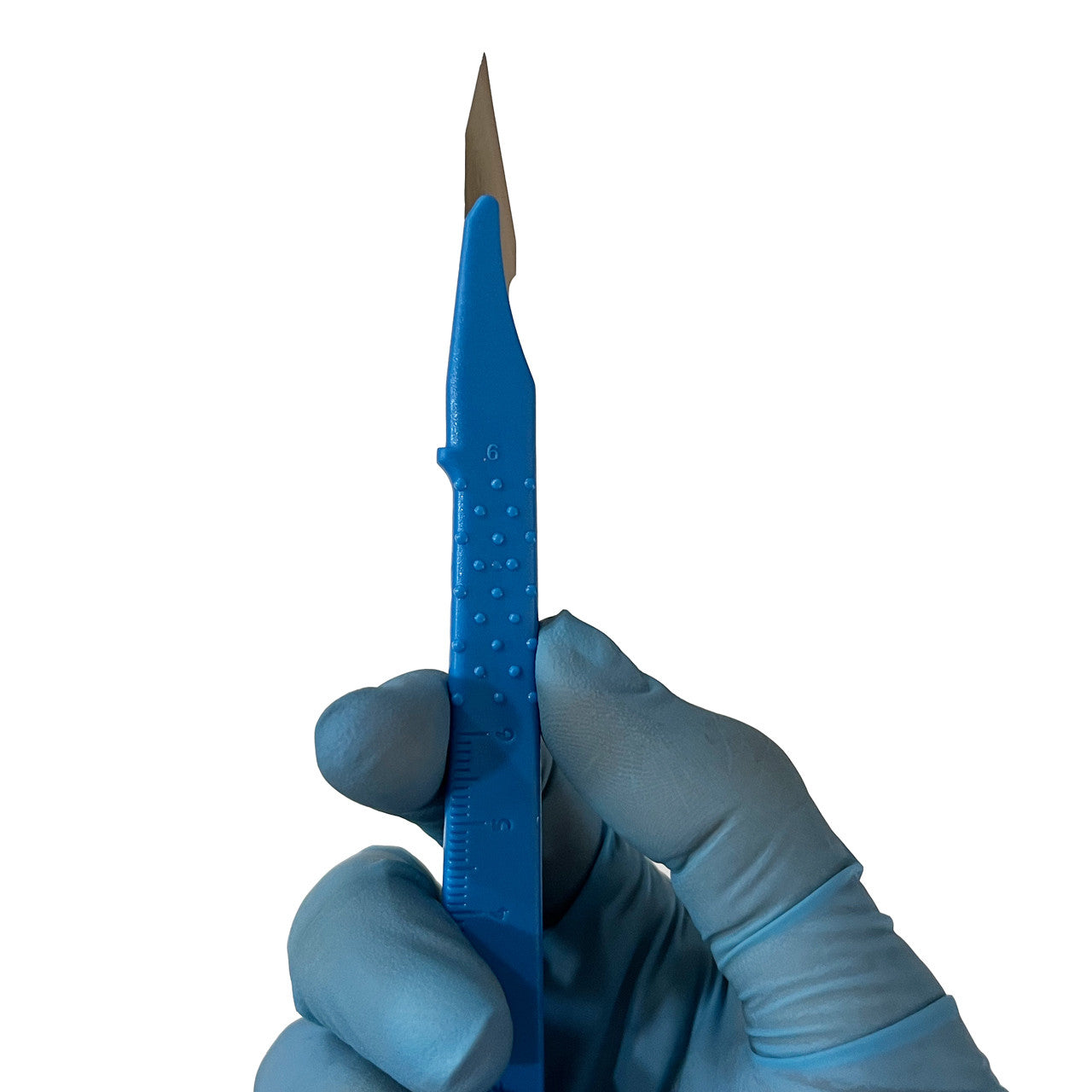 Scalpel, in hand showing tip