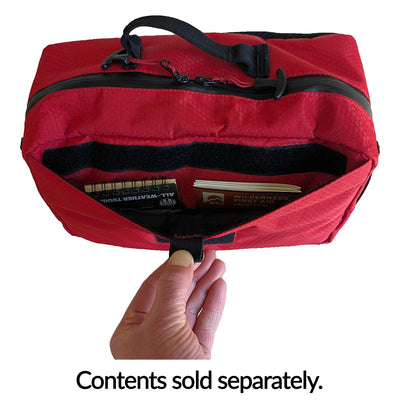 Agilis Medical Hip Pack front pocket open with notebooks