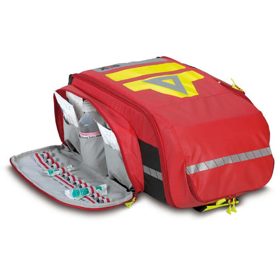 Pax Flight Medic red backpack, frontside facing up, large side pocket flap open. 