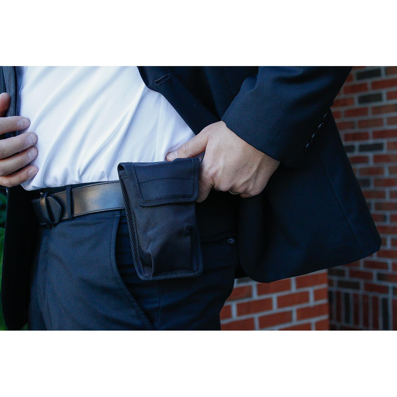 Patrol Officer's Pocket Trauma Kit shown on belt in holster
