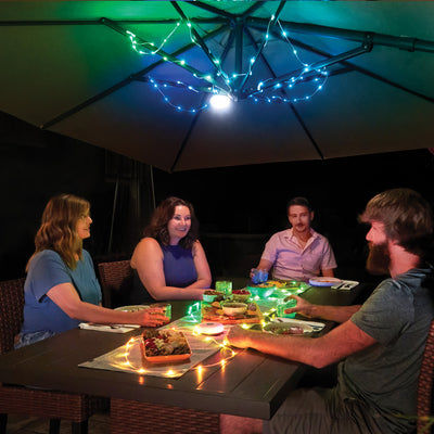 Radiant® StarLit™ Rechargeable Lantern + String Light, in use on patio