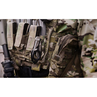 Leatherman RAPTOR Emergency Medical Tool with black handle mounted on ammo vest